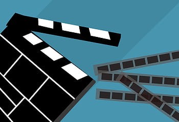 Movie clapboard with film around it