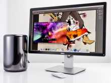 Mac Pro computer monitor an mose on a table