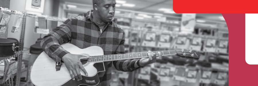 A man playing a guitar A man playing a guitar