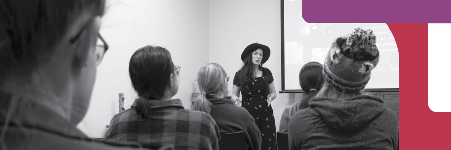 Woman talking to a group of people.