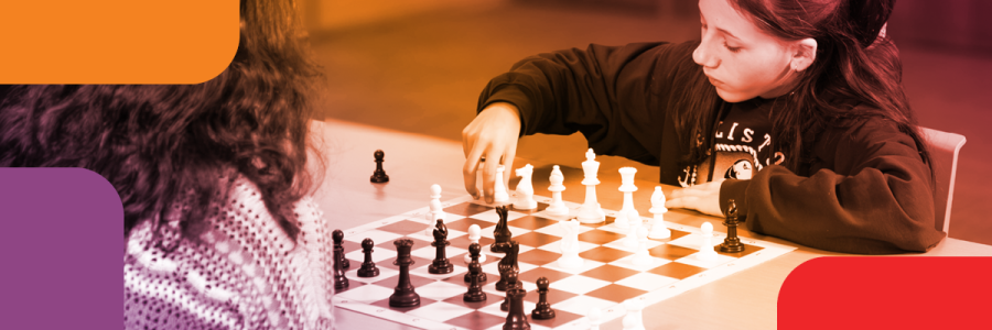 A girl plays chess