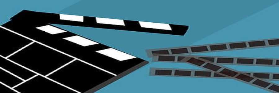 Movie clapboard with film around it