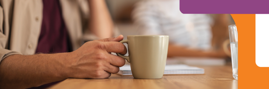 Man holding cup of coffee