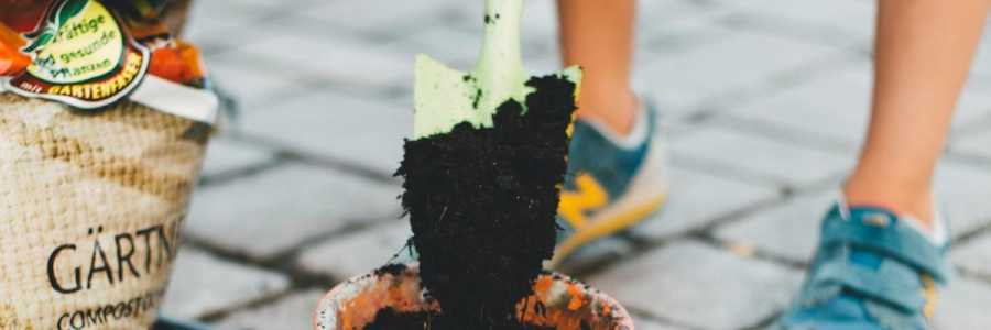 Gardening with compost and trowel