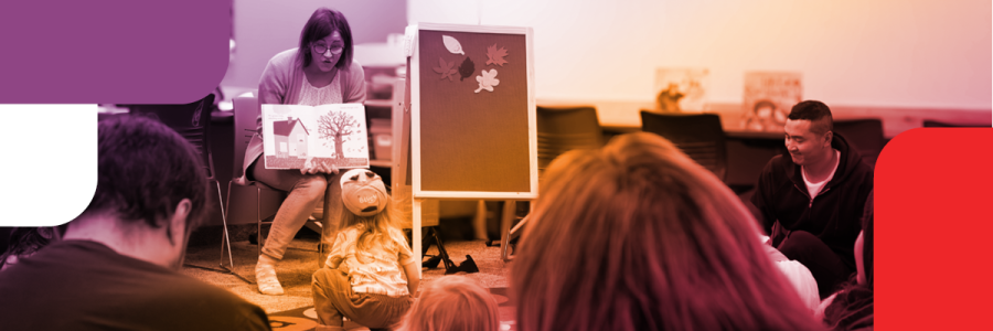 Adult reads picture book to children