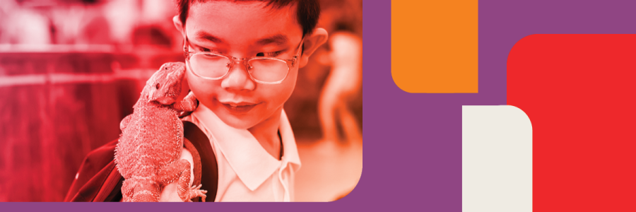 Boy with a lizard standing on his shoulder