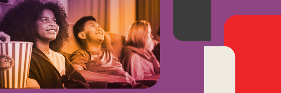 Two children wearing homemade robot and monster costumes made from cardboard boxes.