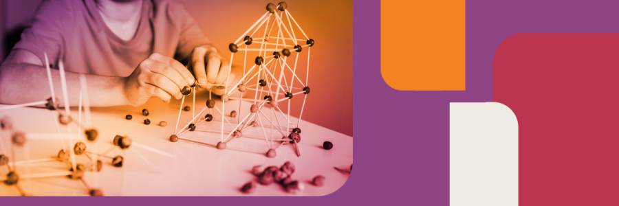 Person building 3-D shapes with playdough and toothpicks