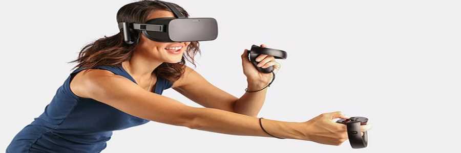 smiling woman playing with virtual reality equipment