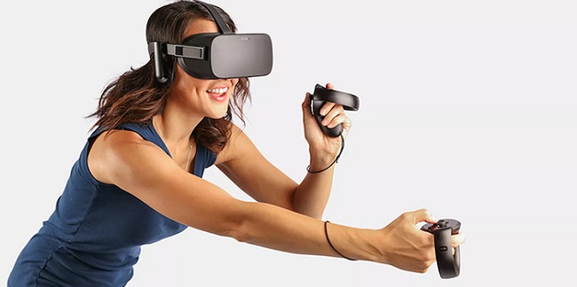smiling woman playing with virtual reality equipment